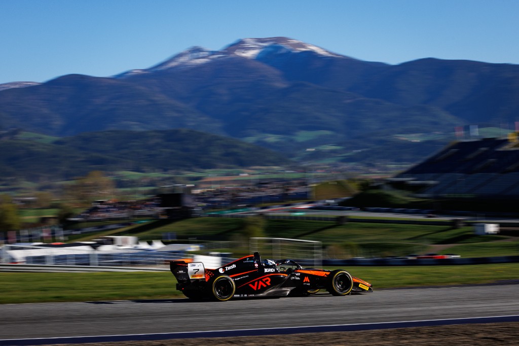 Andrea Dupé's FREC car with Alpine mountains in the background — Spielberg