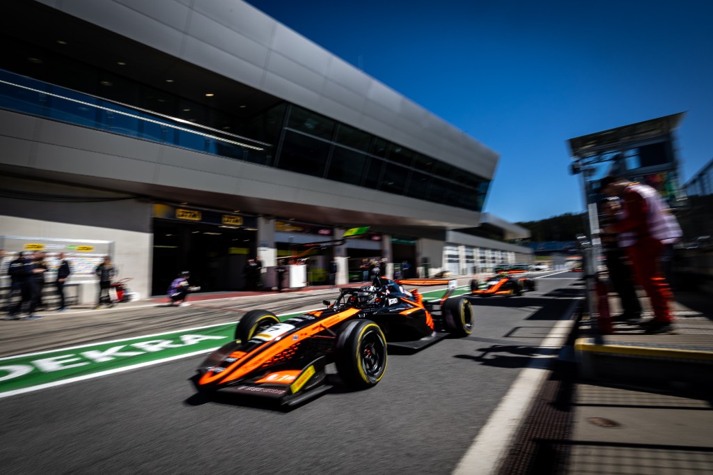 Andrea Dupé exiting the pit lane at Spielberg — DEKRA building